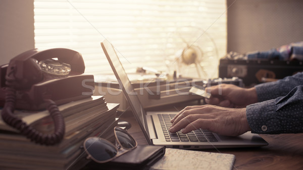 Man booking a vacation online with a credit card Stock photo © stokkete