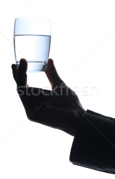 man  with a glass of water, only hand Stock photo © stokkete