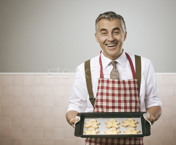 Man cooking gingerbread men Stock photo © stokkete