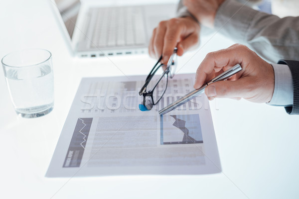 Business team examining a financial report Stock photo © stokkete