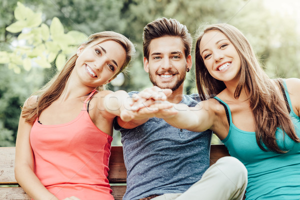 Stock photo: Teenagers stacking hands