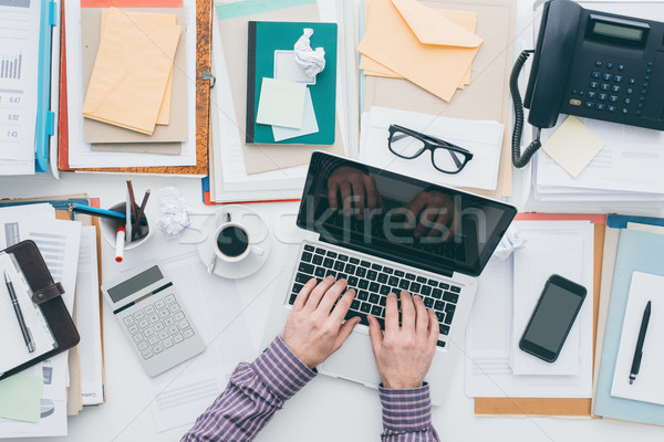 Businessman working with a laptop Stock photo © stokkete