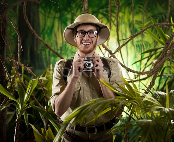 Young photographer in the jungle Stock photo © stokkete