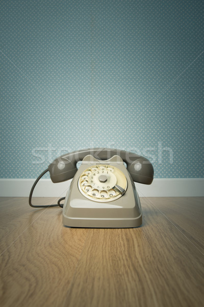 Stock photo: Gray vintage phone on the floor
