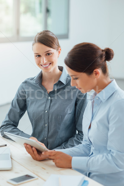 Business women working together with a tablet Stock photo © stokkete