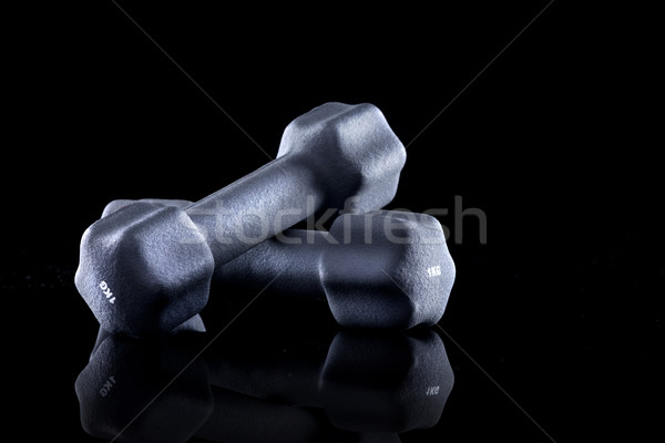 Une kilogramme haltères noir gymnase Photo stock © stokkete