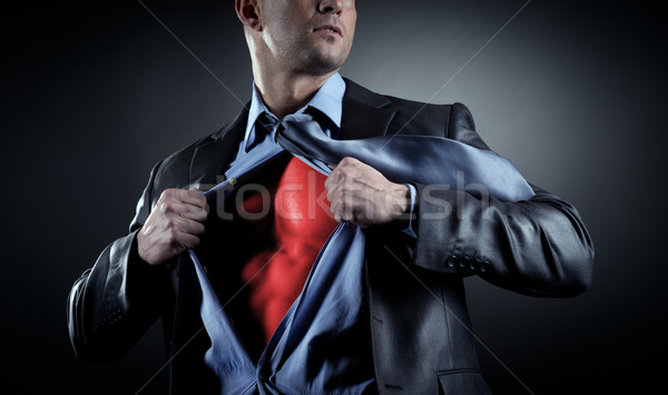 üzletember vonzó férfi el póló mutat Stock fotó © stokkete