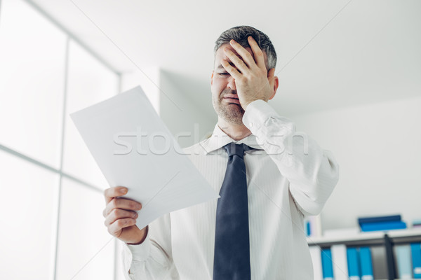 Office worker receiving a dismissal letter Stock photo © stokkete