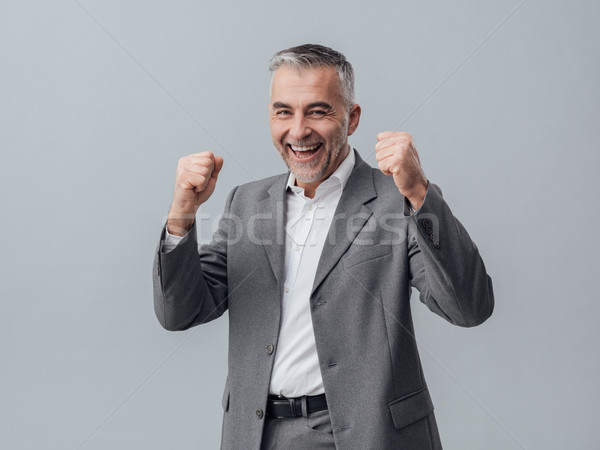 Cheerful successful businessman Stock photo © stokkete