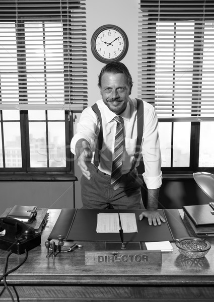 Handdruk glimlachend directeur kantoor 1950 stijl Stockfoto © stokkete