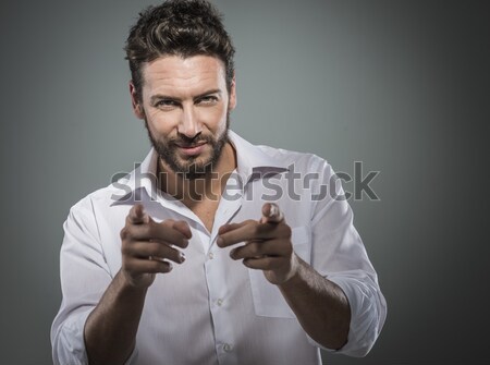 Attractive man getting ready to go out Stock photo © stokkete