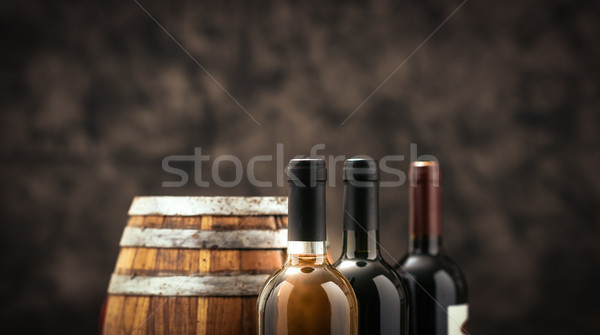 Drága bor gyűjtemény üvegek fából készült hordó Stock fotó © stokkete