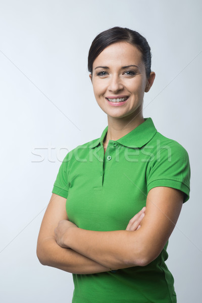 Smiling woman in green polo t-shirt Stock photo © stokkete