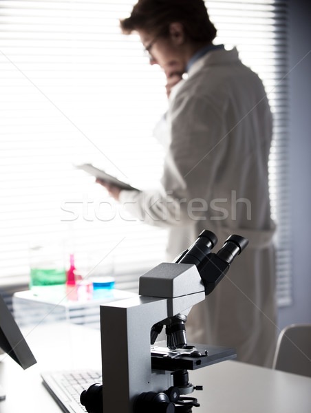 Researcher reading medical records Stock photo © stokkete