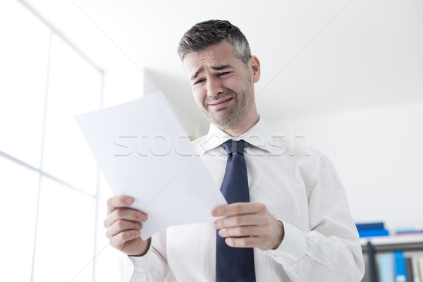 Office worker receiving a dismissal letter Stock photo © stokkete