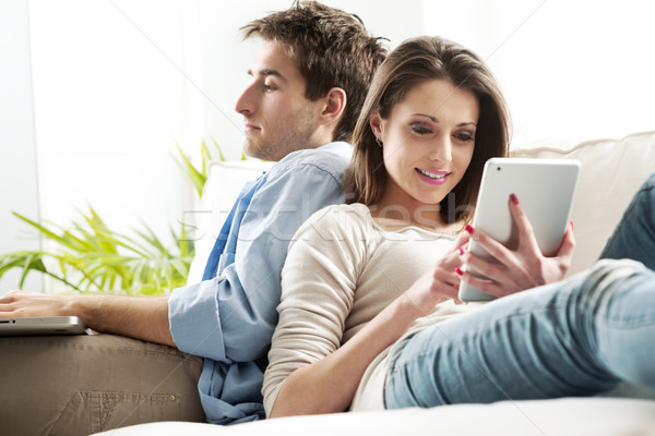 Stock photo: Couple surfing the net at home