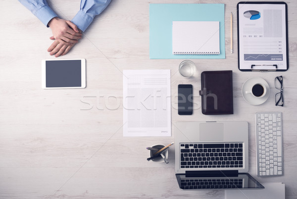 Businessman working at desk with a digital tablet Stock photo © stokkete