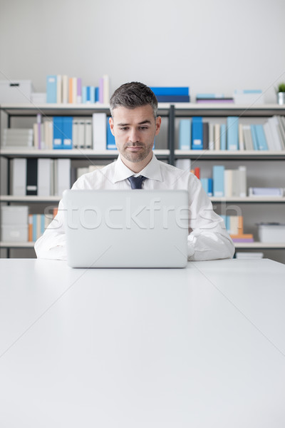 Businessman working with a laptop Stock photo © stokkete