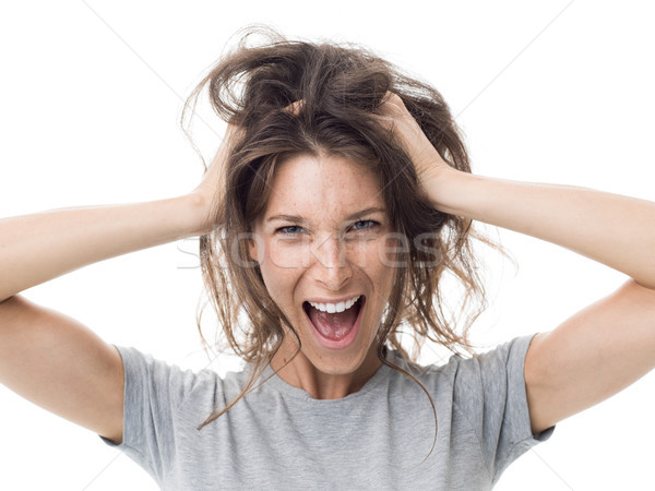 Angry woman having a bad hair day Stock photo © stokkete