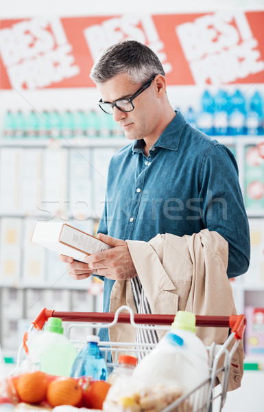 Man reading food labels Stock photo © stokkete