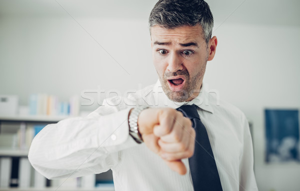 Stock photo: Business checking the time