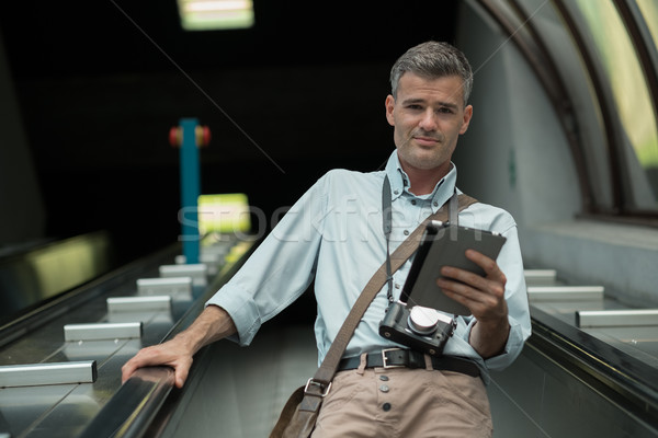 Tourist on the escalator Stock photo © stokkete