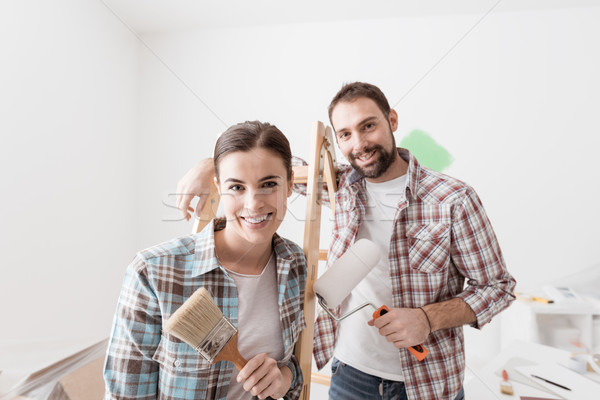 Creative couple renovating their house Stock photo © stokkete