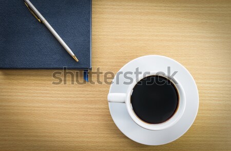 Café cuaderno mesa de madera taza oficina pluma Foto stock © stoonn