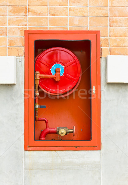 Fire extinguishers on wall Stock photo © stoonn