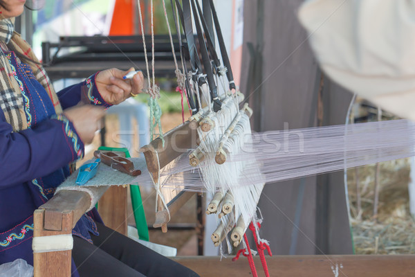 Woman weaving white pattern on loom Stock photo © stoonn