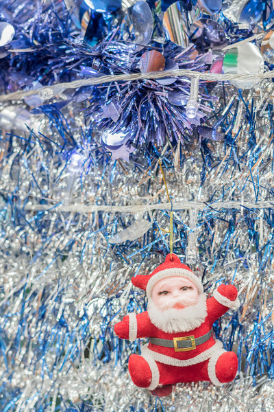 Stock photo:  Santa Claus on tinsel  background