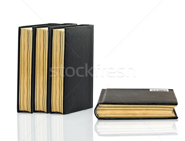 Closed black book with shadow on white background Stock photo © stoonn