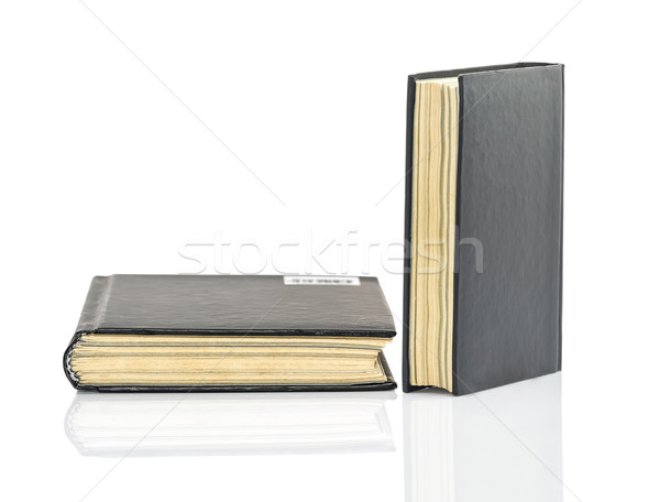 Black hardcover book on white glossy background Stock photo © stoonn