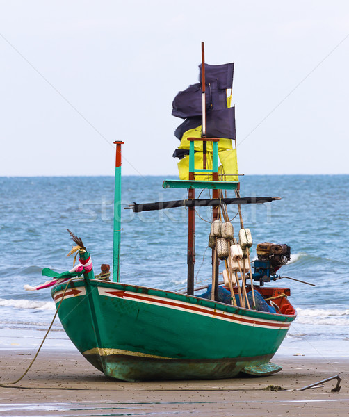 Fishing boat on the beach Stock photo © stoonn