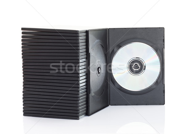 Stock photo:  Dvd boxes with disc on white background