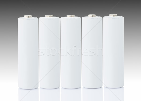 AA batteries over white Stock photo © stoonn