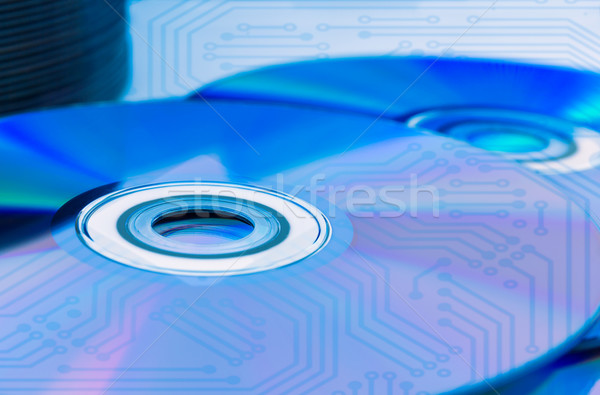 Closeup compact discs (CD/DVD) with the circuit board Stock photo © stoonn