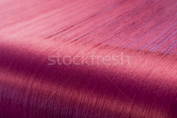 Stock photo: Green silk on a warping loom of a textile mill  