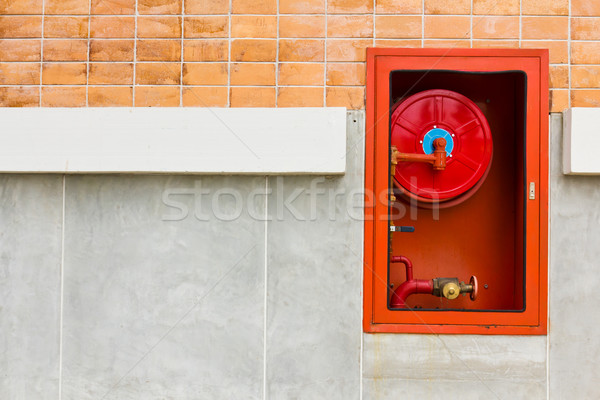 Fire extinguishers on wall Stock photo © stoonn