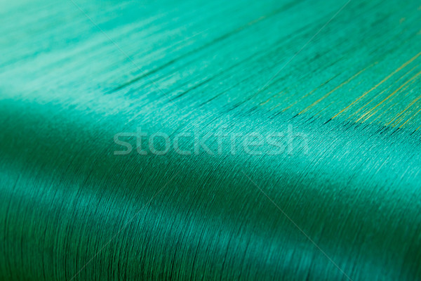 Green silk on a warping loom of a textile mill   Stock photo © stoonn