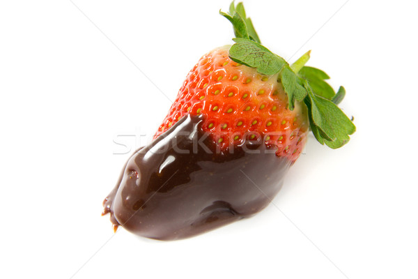 Stock photo: Lonely strawberry dipped in melted chocolate