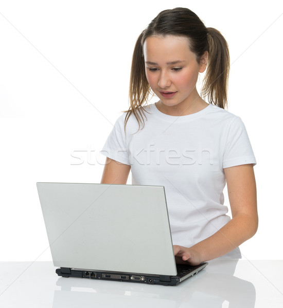 Pretty young girl using a laptop computer Stock photo © stryjek