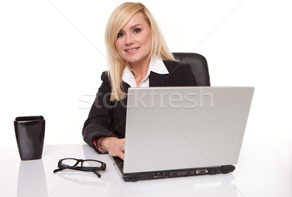 Efficient businesswoman working on her laptop Stock photo © stryjek