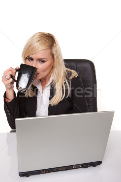 Efficient businesswoman working on her laptop Stock photo © stryjek