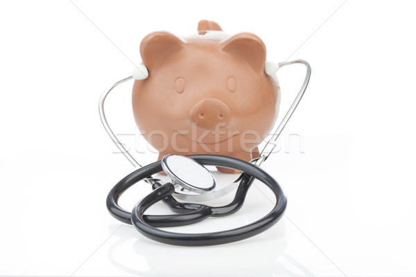 Piggy bank estetoscópio imagem custo saúde Foto stock © stryjek