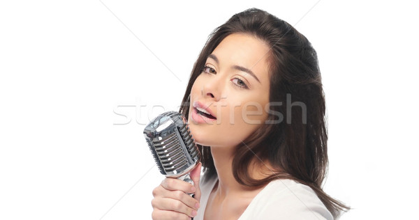 Preety woman singing into a microphone Stock photo © stryjek