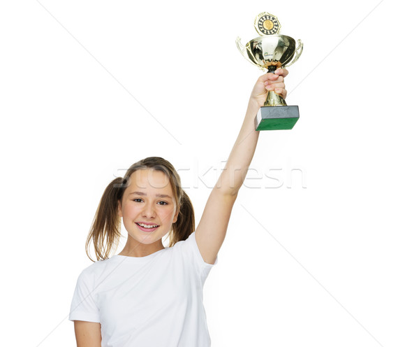 Young female champion raising trophy Stock photo © stryjek