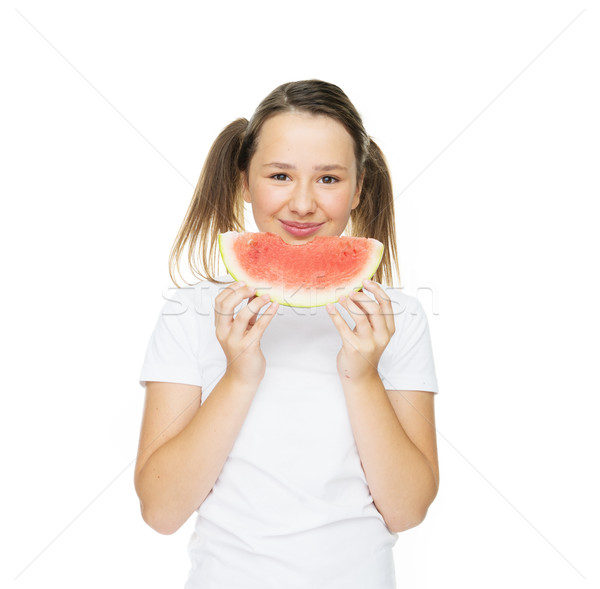 Sonriendo joven comer rebanada sandía mirando Foto stock © stryjek