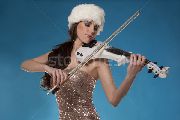 Beautiful woman playing a violin against blue sky Stock photo © stryjek