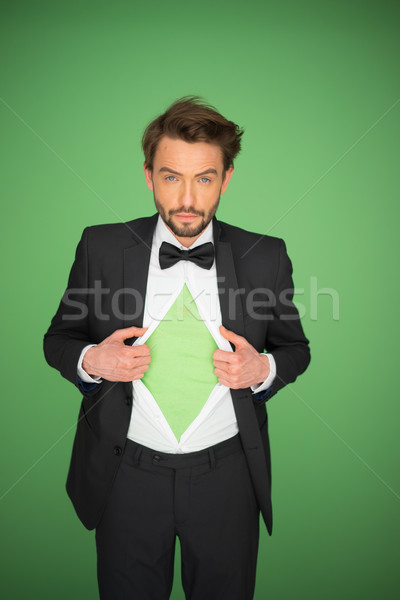 Man in a suit and bow tie revealing his chest Stock photo © stryjek